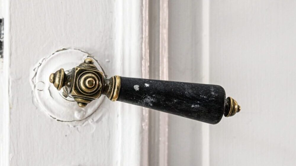 Detail of vintage door with period style door handle